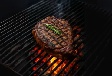 alt="Grill ribeye steak on charcoal grill step by step"
